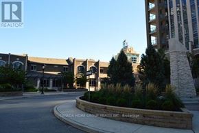 Mississauga (City Centre) condo for rent - The image shows a real estate company's office with a sign in front.
