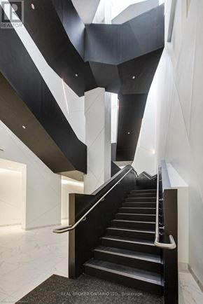 Toronto (Niagara) condo for rent - A staircase with a black and white design.