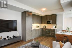 Toronto (Kensington-Chinatown) condo for rent - A modern kitchen with wooden cabinets and a TV mounted on the wall.