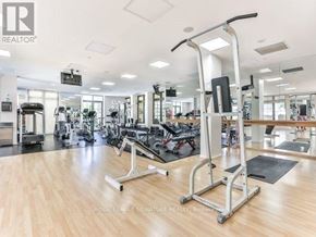 Toronto (Willowdale East) condo for rent - A gym with a variety of equipment including treadmills, weights, and exercise machines.
