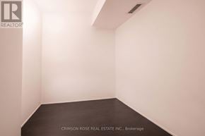 Toronto (Church-Yonge Corridor) condo for rent - A white room with a black floor and a logo on the wall.