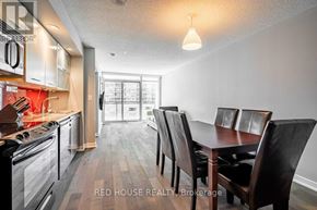 Toronto (Waterfront Communities) condo for rent - A kitchen with a dining table and chairs.