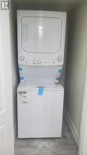 Brampton (Northwest Sandalwood Parkway) apartment for rent - A white dishwasher is in a small space.