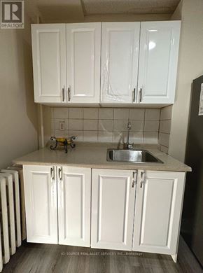 Mississauga (Lakeview) apartment for rent - A kitchen with white cabinets and a sink.