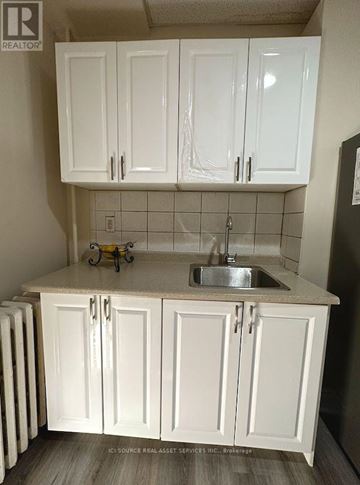 Mississauga (Lakeview) apartment for rent - A kitchen with white cabinets and a sink.