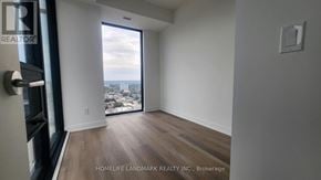 Hamilton (Beasley) condo for rent - A room with a view of the city through a large window.