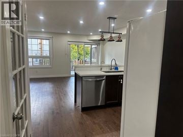 Kitchener townhouse for rent - A kitchen with a sink and a dishwasher.
