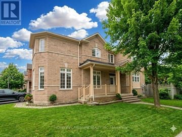 Markham (Wismer) apartment for rent - A brick house with a black car parked in front.
