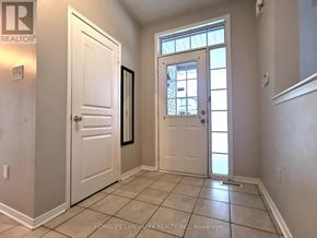 Markham (Wismer) apartment for rent - A hallway with a white door and a window with a white frame.