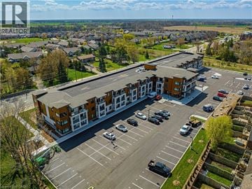 Binbrook apartment for rent - A spacious living room with a sofa set and a rug.