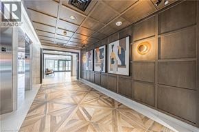 Binbrook apartment for rent - A hallway with a wooden floor and a wall of pictures.