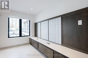 Hamilton (Binbrook) multi-family for rent - A room with a large window and a calendar on the wall.