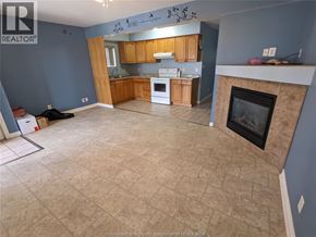 Windsor multi-family for rent - A kitchen with a fireplace and a dining table.