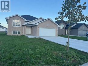 Lakeshore apartment for rent - A house with a REALTOR® sign in front of it.