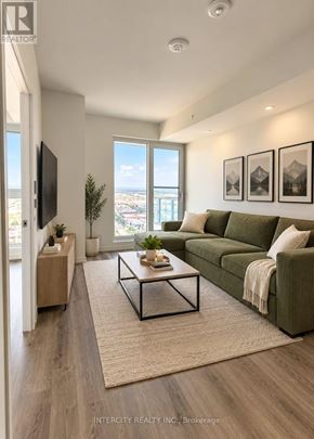 Vaughan (Vaughan Corporate Centre) condo for rent - A living room with a green couch and a flat screen TV mounted on the wall.