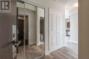 Vaughan (Beverley Glen) condo for rent - A realtor photo of a bedroom with a white door and a brown door.