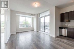 Vaughan (Beverley Glen) condo for rent - A spacious living room with a large window and sliding glass doors.
