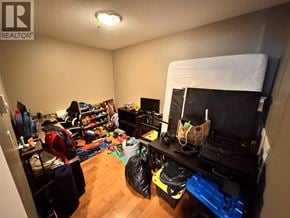 Burnaby townhouse for rent - A room with a lot of clutter and a bed in the corner.