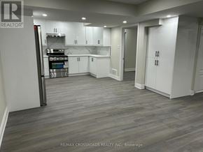 Ajax (Northwest Ajax) apartment for rent - A kitchen with white cabinets and a wooden floor.