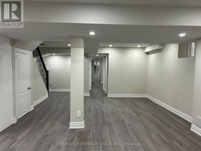 Ajax (Northwest Ajax) apartment for rent - A spacious room with wooden flooring and white walls.