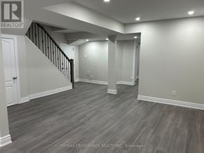 Ajax (Northwest Ajax) apartment for rent - A spacious room with wooden flooring and a staircase.
