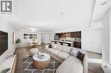 Oakville townhouse for rent - A modern living room with a white sofa and a coffee table.