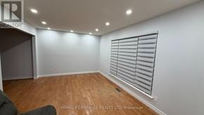 Toronto (Malvern) apartment for rent - A room with wooden flooring and a window with blinds.