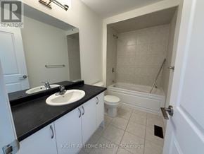 Brant (Paris) apartment for rent - A bathroom with a sink, toilet, and bathtub.