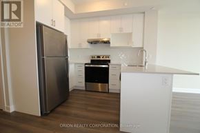 Oakville (Jm Joshua Meadows) condo for rent - A kitchen with a refrigerator, stove, and oven.