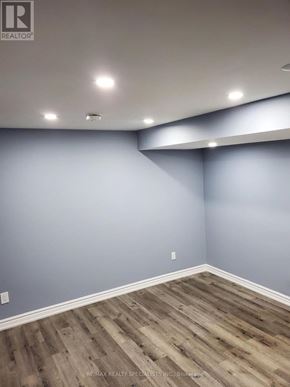 Brampton (Brampton South) apartment for rent - A room with wooden flooring and grey walls.