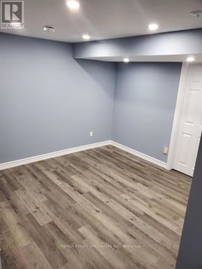 Brampton (Brampton South) apartment for rent - A room with wooden flooring and a white door.