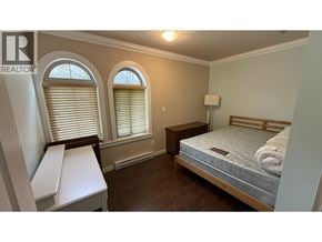 Richmond apartment for rent - A bedroom with a bed, nightstand, and window with blinds.