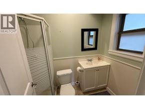 Richmond apartment for rent - A bathroom with a toilet, sink, and shower.