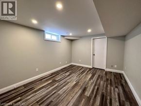 Kitchener apartment for rent - A room with wooden flooring and a window.