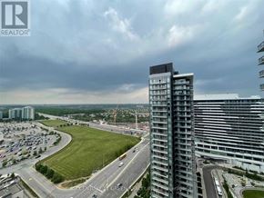 Mississauga (Central Erin Mills) condo for rent - A real estate company logo is displayed on a building in a cityscape.