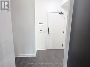 Mississauga (Central Erin Mills) condo for rent - A white door with a black handle is in a room with white walls.