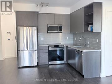 Mississauga (Central Erin Mills) condo for rent - A modern kitchen with stainless steel appliances and grey cabinets.