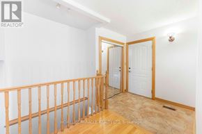 Oshawa (Samac) apartment for rent - A room with a wooden balcony and white walls.