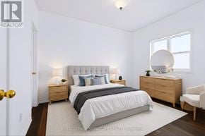 Aurora (Bayview Wellington) apartment for rent - A bedroom with a bed, nightstands, and a chair.