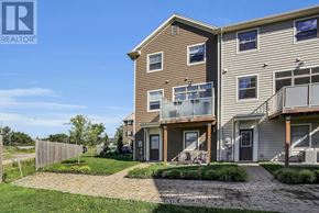 London North (North I) townhouse for rent - A RE/MAX REALTOR® sign is on a building in a residential area.