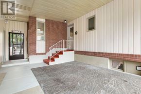 Tillsonburg apartment for rent - A realtor's office with a staircase leading to the second floor.