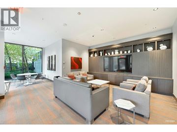 Burnaby apartment for rent - A living room with a grey couch and a red painting on the wall.