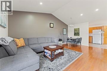 Windsor townhouse for rent - A living room with a grey couch and a coffee table.