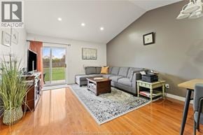 Windsor townhouse for rent - A living room with a grey couch and a wooden floor.