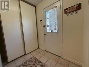 Toronto (L'amoreaux) townhouse for rent - A hallway with a door and a wall hanging.