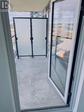 Pickering (Bay Ridges) condo for rent - A glass door with a handle is open.