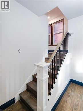 Hamilton apartment for rent - A staircase with a wooden handrail and white balusters.