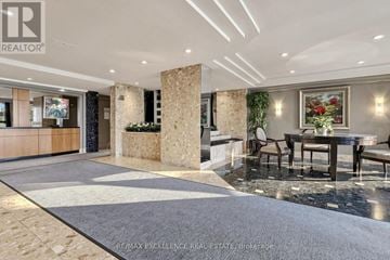 Toronto (West Humber-Clairville) condo for rent - A spacious living room with a dining table and chairs.