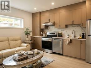Vancouver apartment for rent - A modern kitchen with a marble countertop and stainless steel appliances.