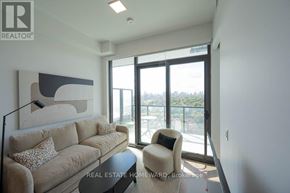 Toronto (Bayview Village) condo for rent - A living room with a couch, chair, and a painting on the wall.